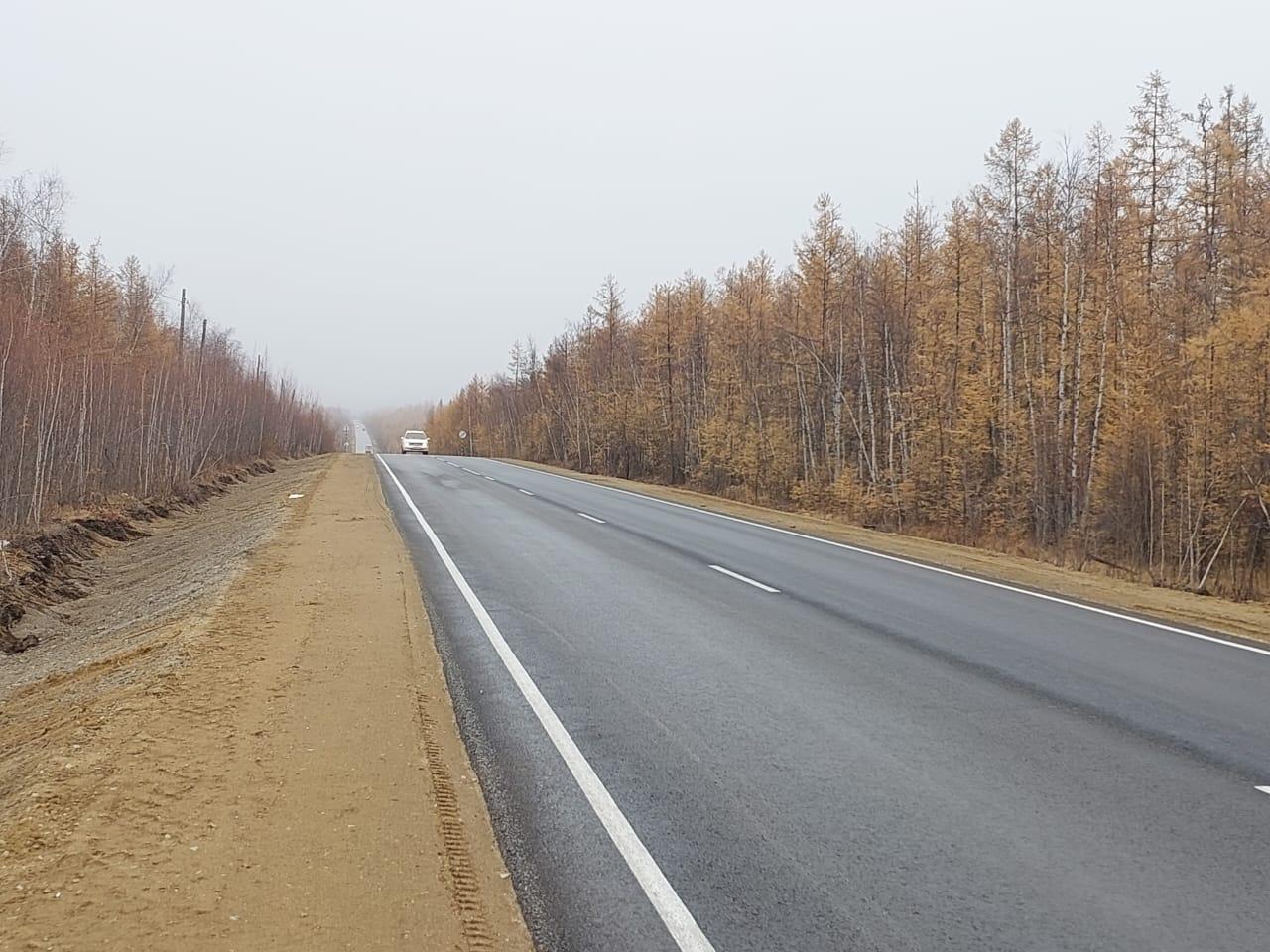 Готов к сдаче десятикилометровый участок автодороги «Нам» На стадии завершения находится ремонт участка с 44 по 54 километр а...